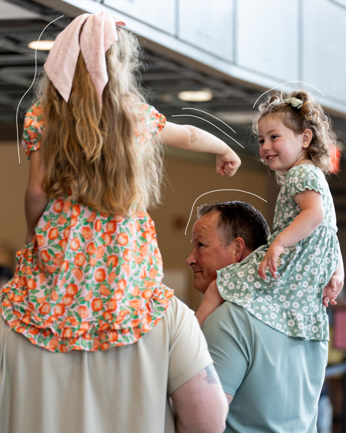 A parent holding a baby at a Shelter Cove family event