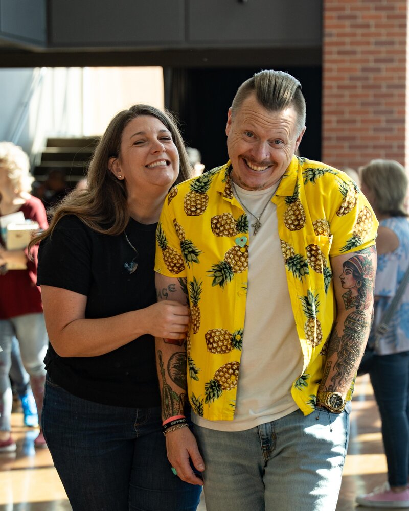 A married couple laughing and smiling together